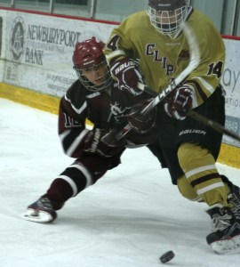 GHS 12 - Maggie Fifield battles for the puck against Portsmouth. (Photo by Charron)